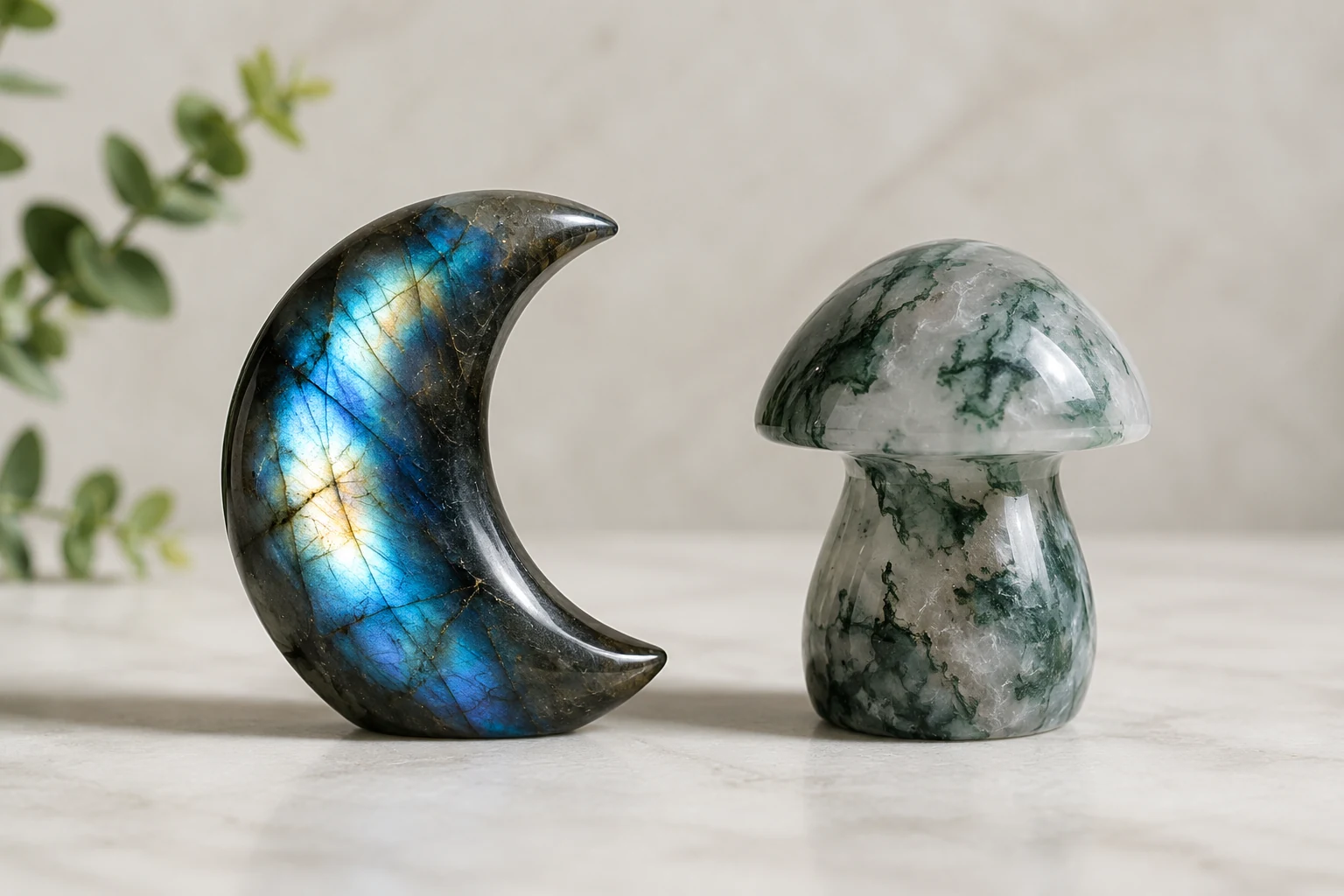 Comparing evergreen vs. trending popular crystal carvings: a labradorite moon and a moss agate mushroom