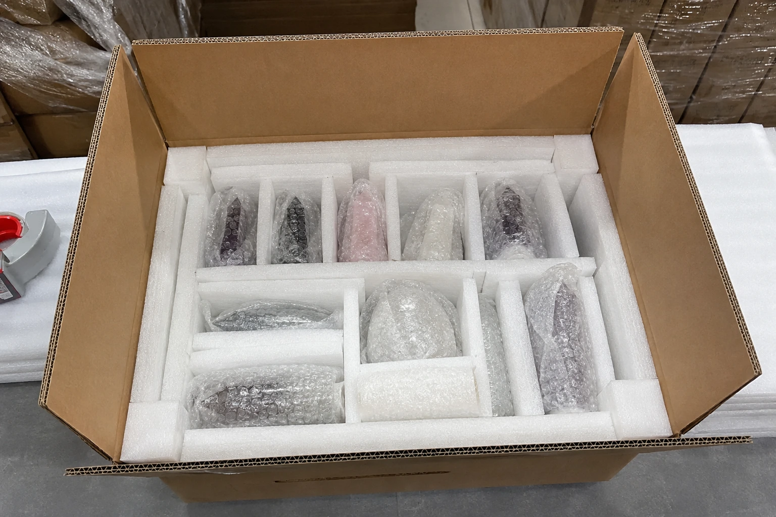 A perfectly packed box of crystal carvings with individual wrapping and a sturdy export carton, ready for importing from China