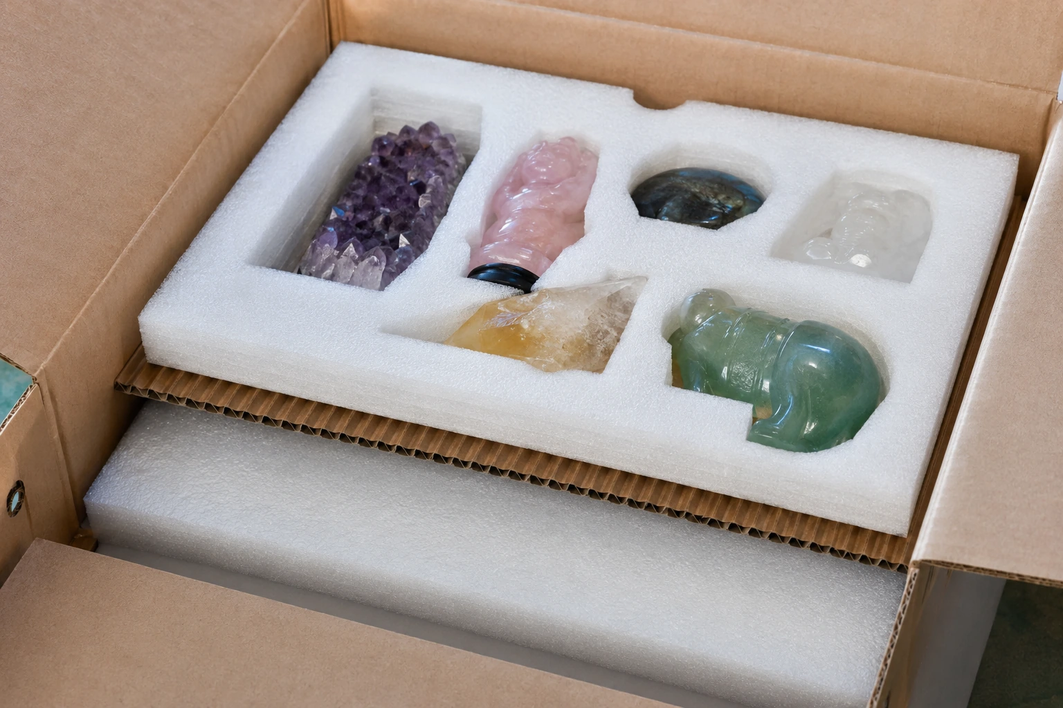 Securely packed crystal carvings nestled in custom-cut EPE foam inside a sturdy export carton