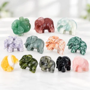 4cm assorted natural crystal elephant carvings displayed on a light minimalist tabletop