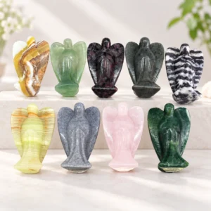 8cm mixed material angel crystal carvings in assorted polished stone colors on a light minimalist tabletop