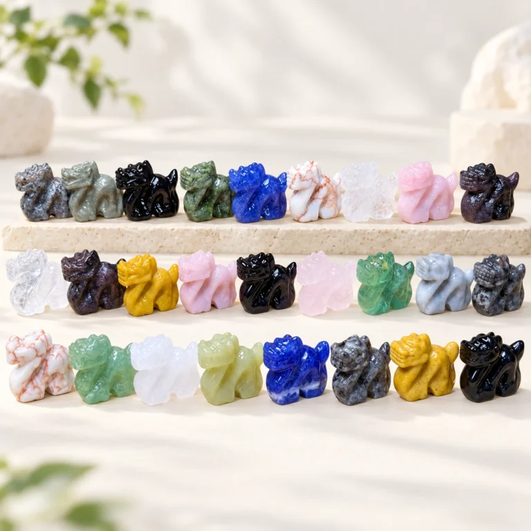 assorted natural crystal Chinese dragon carvings in multiple polished stone colors on a light minimalist tabletop