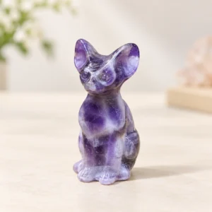 Mixed Sphynx Cat Crystal Carvings on a light minimalist tabletop background