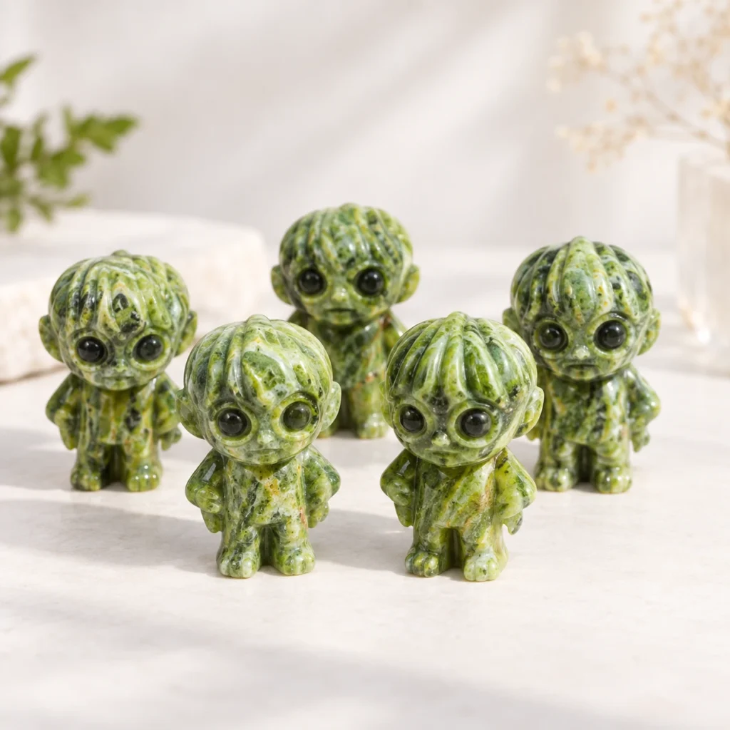 Green natural crystal wizard theme carvings arranged on a light minimalist tabletop
